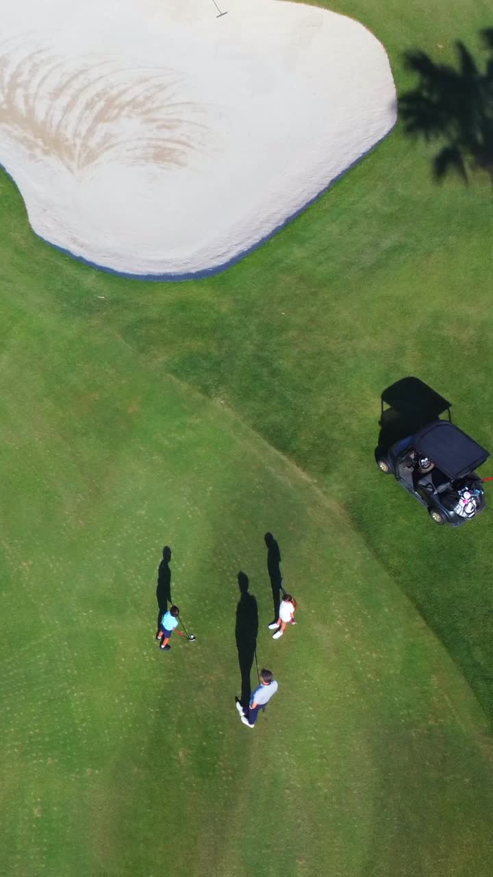 Family Golfing on a Sunny Day