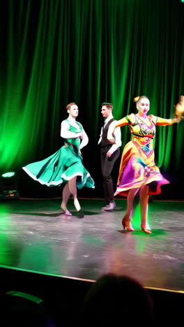 couple performing ballroom dance on stage