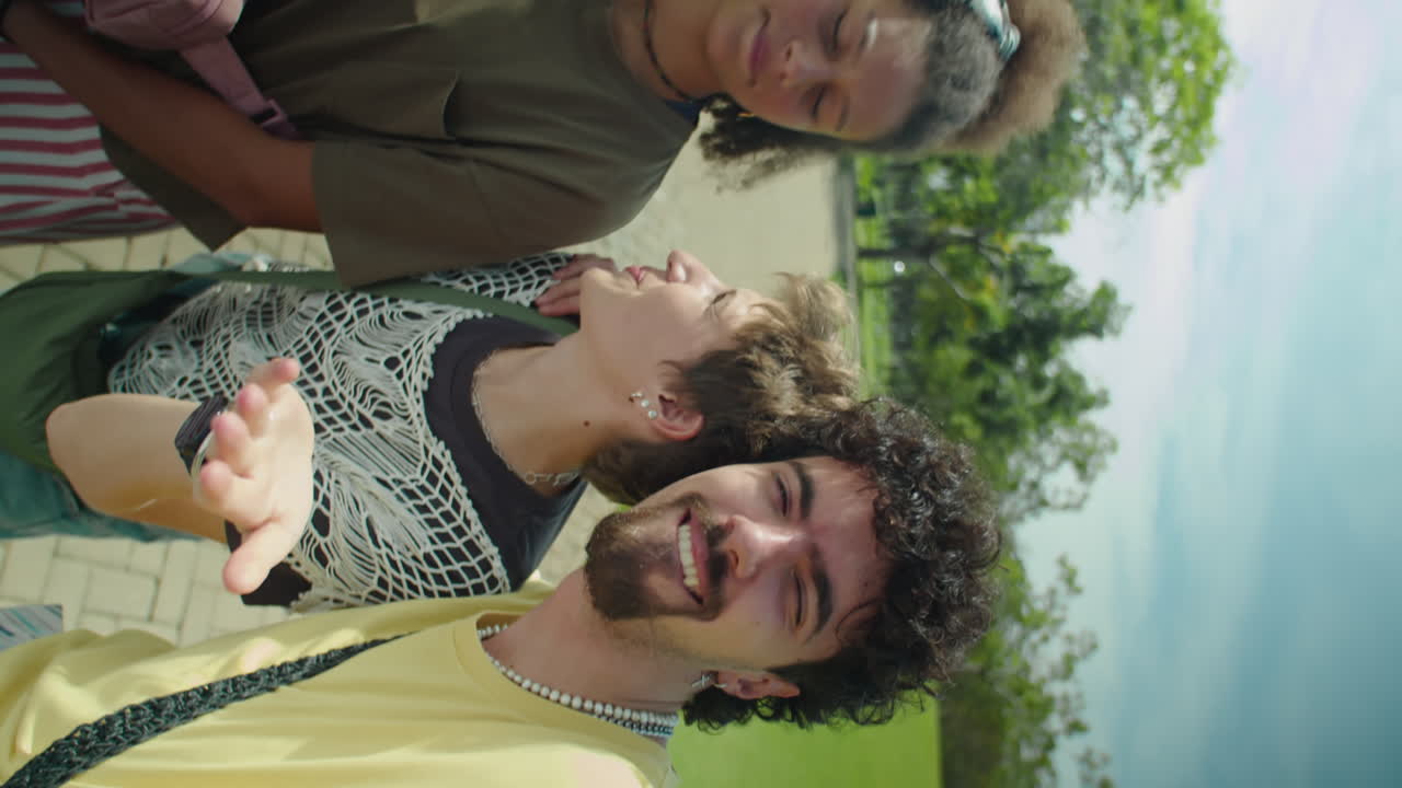 Joyous Young Friends Smiling and Chatting on Camera in Park