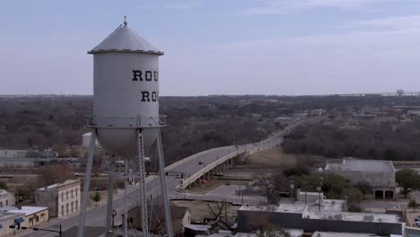 static aerial shot of round rock water tower in round rock, texas with main street in the background