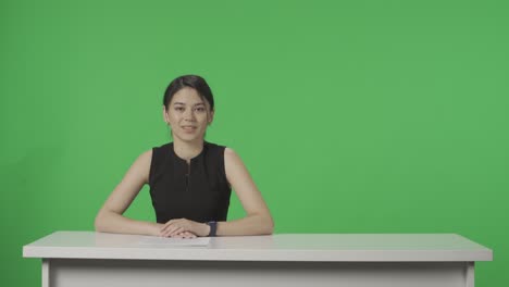 woman news anchor at desk