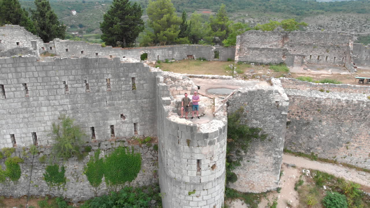 Drone shot of old fortress ruins on a hilltop in Bosnia and Herzegovina