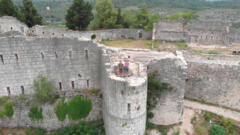 drone shot of old fortress ruins on a hilltop in bosnia and herzegovina