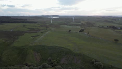 Scottish-countryside-flyover-toward-wind-turbines-at-Whitelee-Windfarm