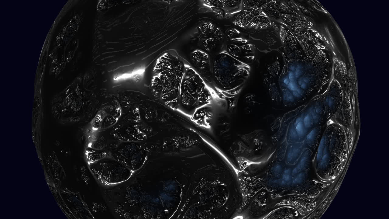 Glowing blue light inside rough black and blue ball