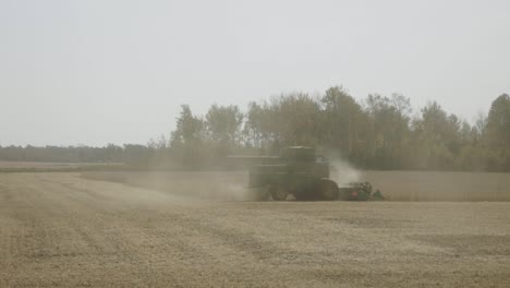 Combine-Harvester-Farm-Tractor-Working-On-Fields
