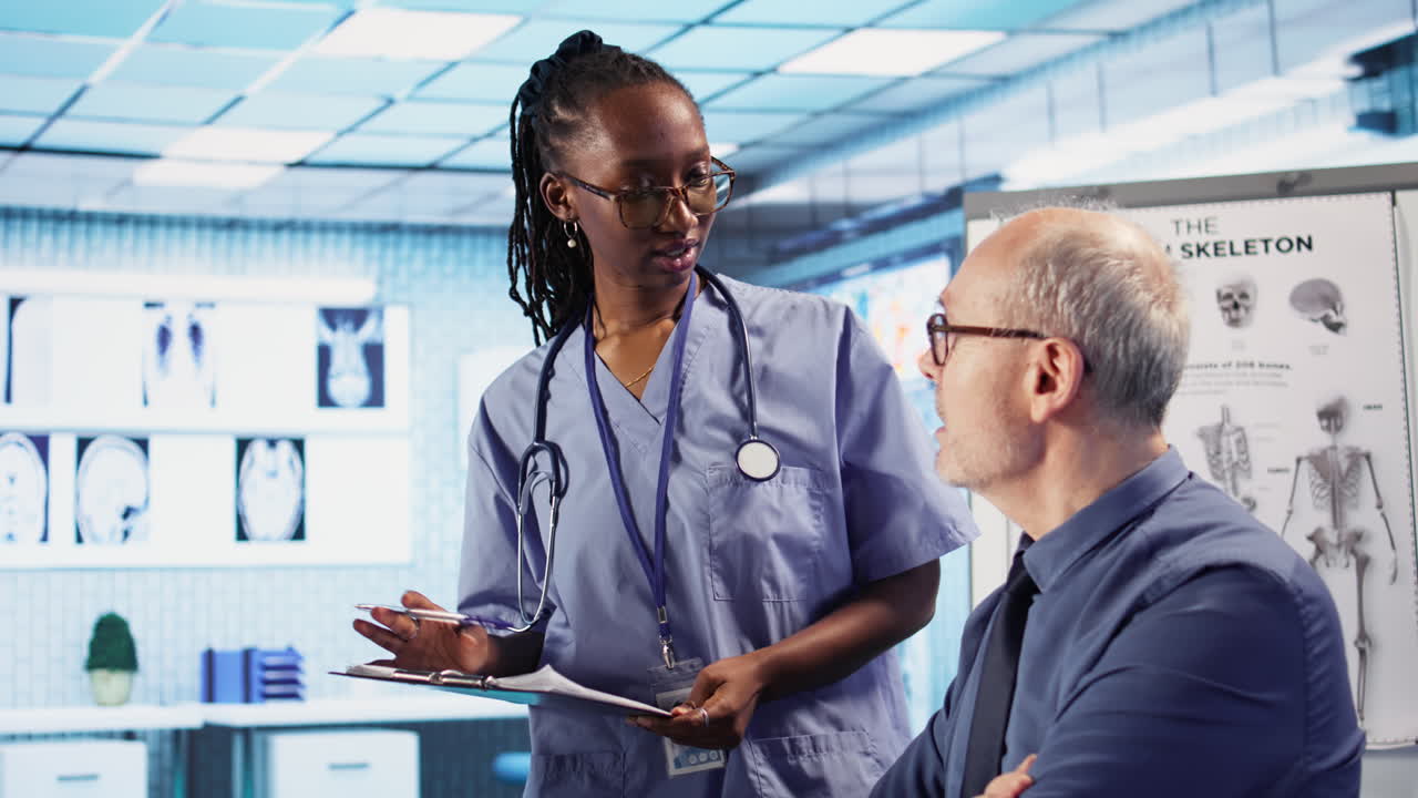 Vertical Video Expert and african american assistant provide medical services to patient