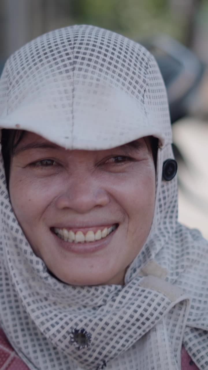 Portrait of a woman in a beekeeping suit