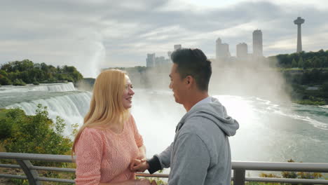 Emotional-Multi-Ethnic-Couple-Have-Fun-Communicating-With-Each-Other-Against-The-Backdrop-Of-The-Nia