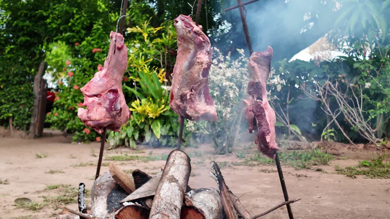 Grilled meat on a stick over an open fire, a traditional cooking method in Venezuela