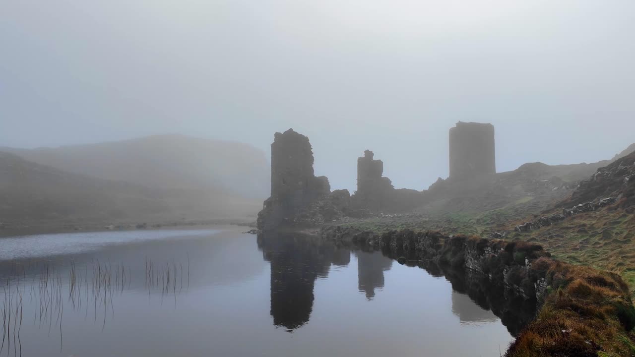 Ireland epic Locations3 Castles Head Mizen west cork ireland haunted castle ruins next to lake on a moody spooky winter morning