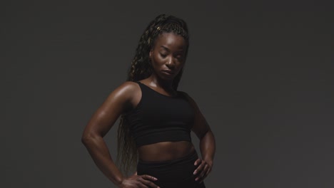 studio portrait of young woman wearing gym fitness clothing for exercise 2