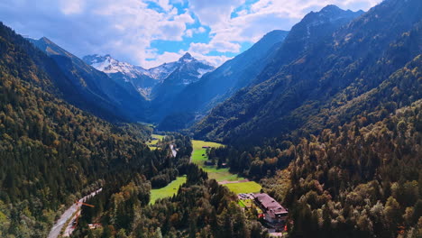 picturesque green valley surrounded by pine trees and high mountains. stunning view on the bavarian alps, europe from top.