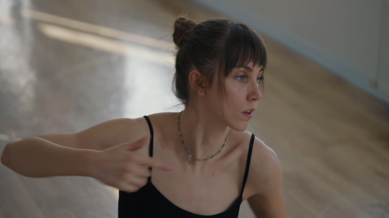 A woman in a dance studio