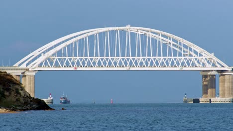 white arch bridge over waterway