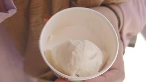 woman enjoying a cup of ice cream