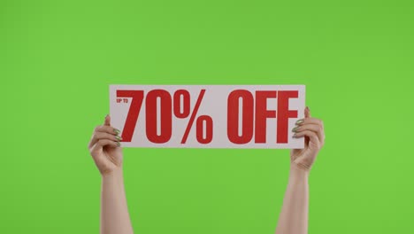 70-Percent-Off-advertisement-inscription-on-paper-sheet-in-womans-hands-on-chroma-key.-Slow-motion