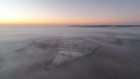 Alvechurch,-Birmingham,-UK---Flying-around-misty-lake-in-the-countryside-sunrise