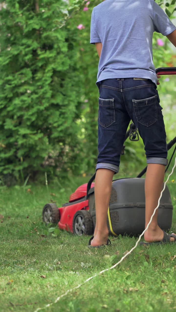 Lawn mowers cut grass. Vertical video