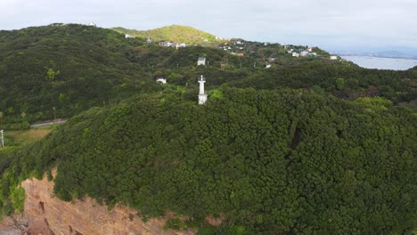 aerial view of lighthouse, wide aerial pan at kada, wakayama japan