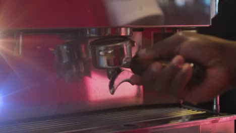 Animation-of-light-spots-over-biracial-man-using-coffee-machine