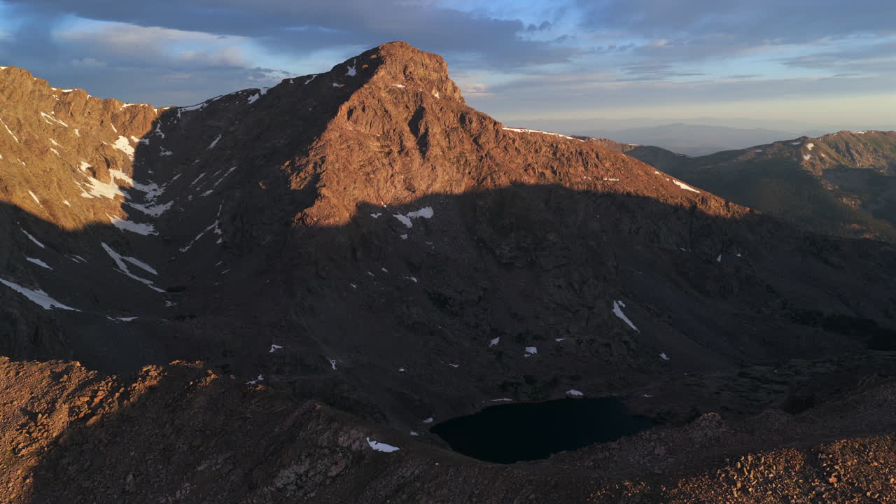Mount of the Holy Cross 14er peak first light summer spring morning sunrise aerial drone Halo Ridge trail Notch Bowl of Tears Lake Sawatch Range Rocky Mountains snow on summit North ridge circle right