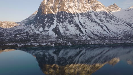 Aerial-drone-over-the-ocean-near-Grøtfjord,-Kvaloya-Northern-Norway