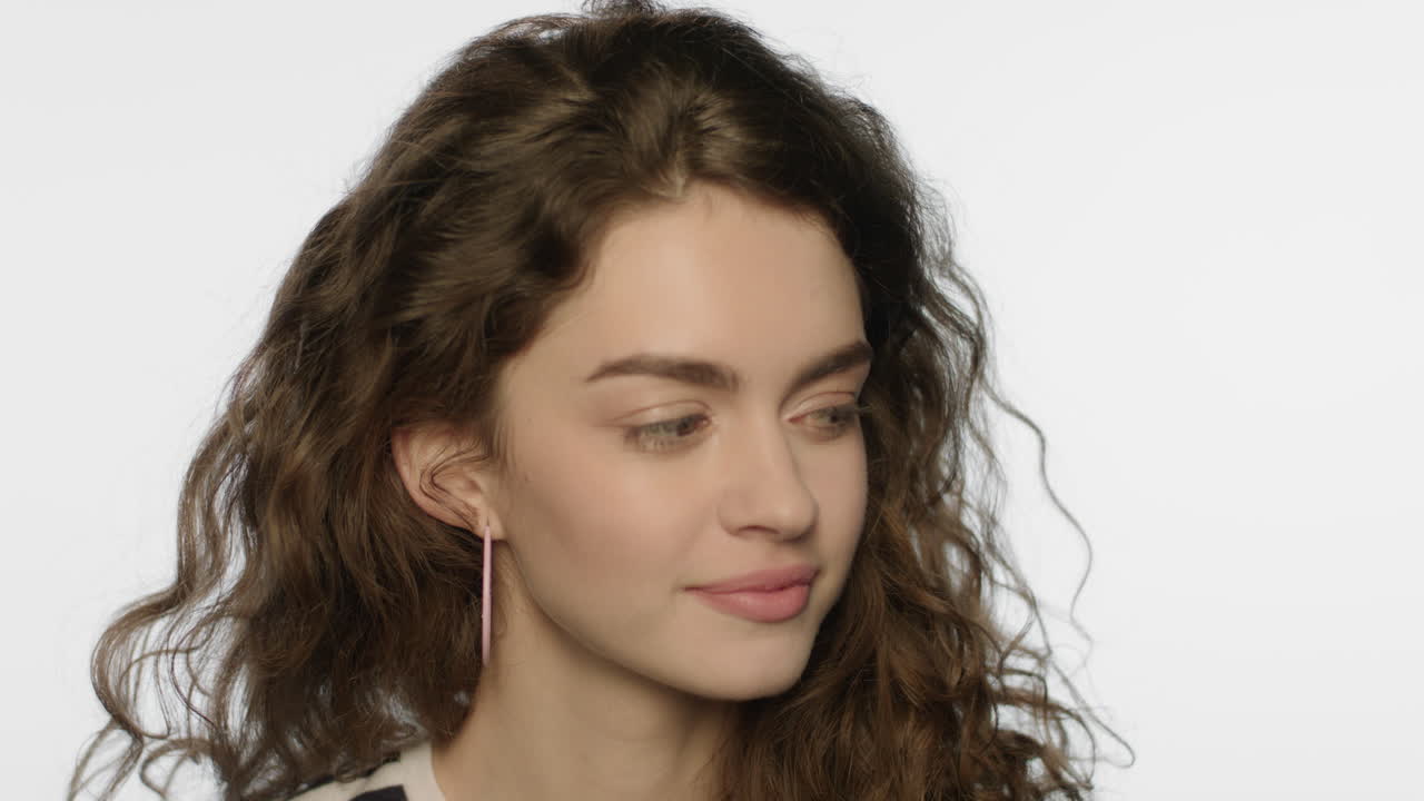 Joyful woman posing on white background