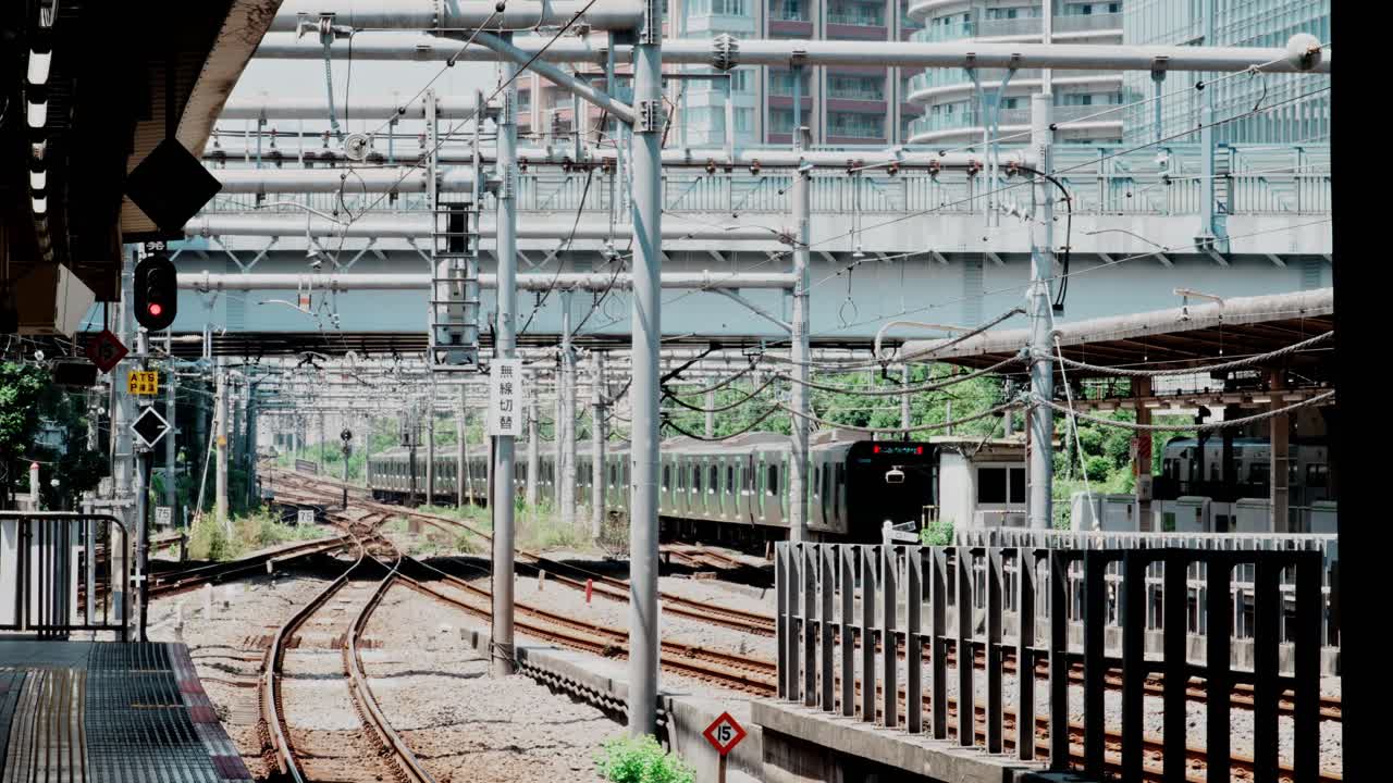 4k cinematic footage of tokyo train leaving the station