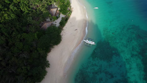 Aerial-drone-view-over-turquoise-tropical-lagoon-with-white-sand