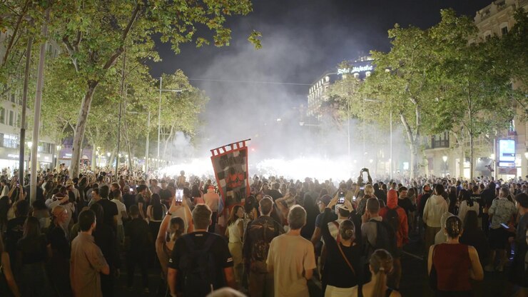 Crowds in the street for the fire run or correfoc, during la merce festival,barcelona spain