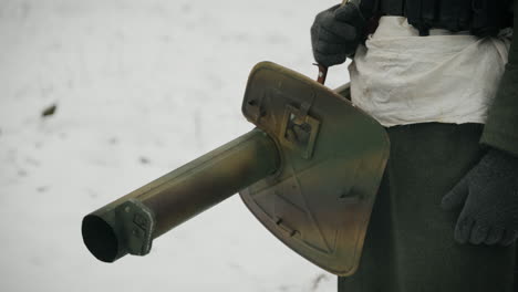 wwii soldier in winter with anti-tank weapon