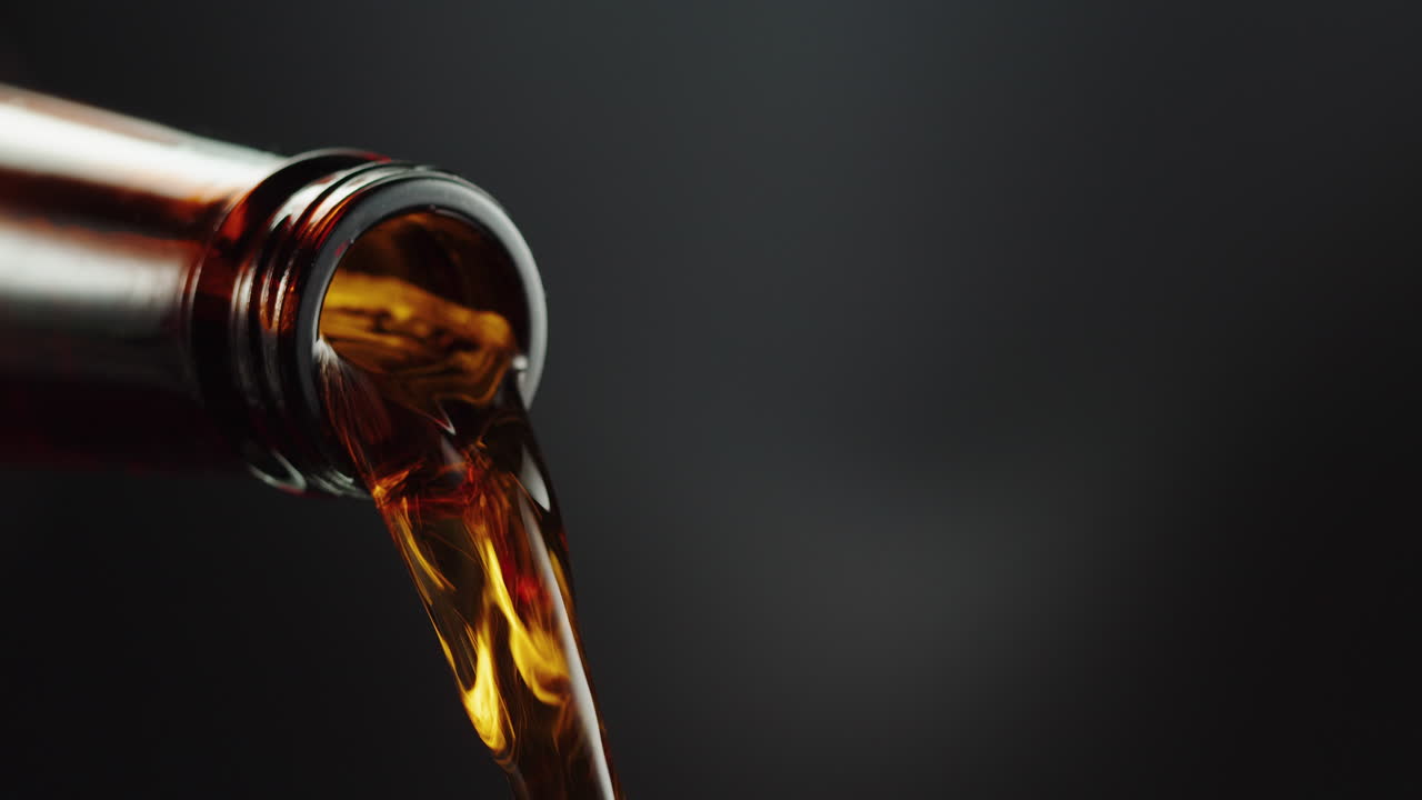 Pouring beer from a bottle