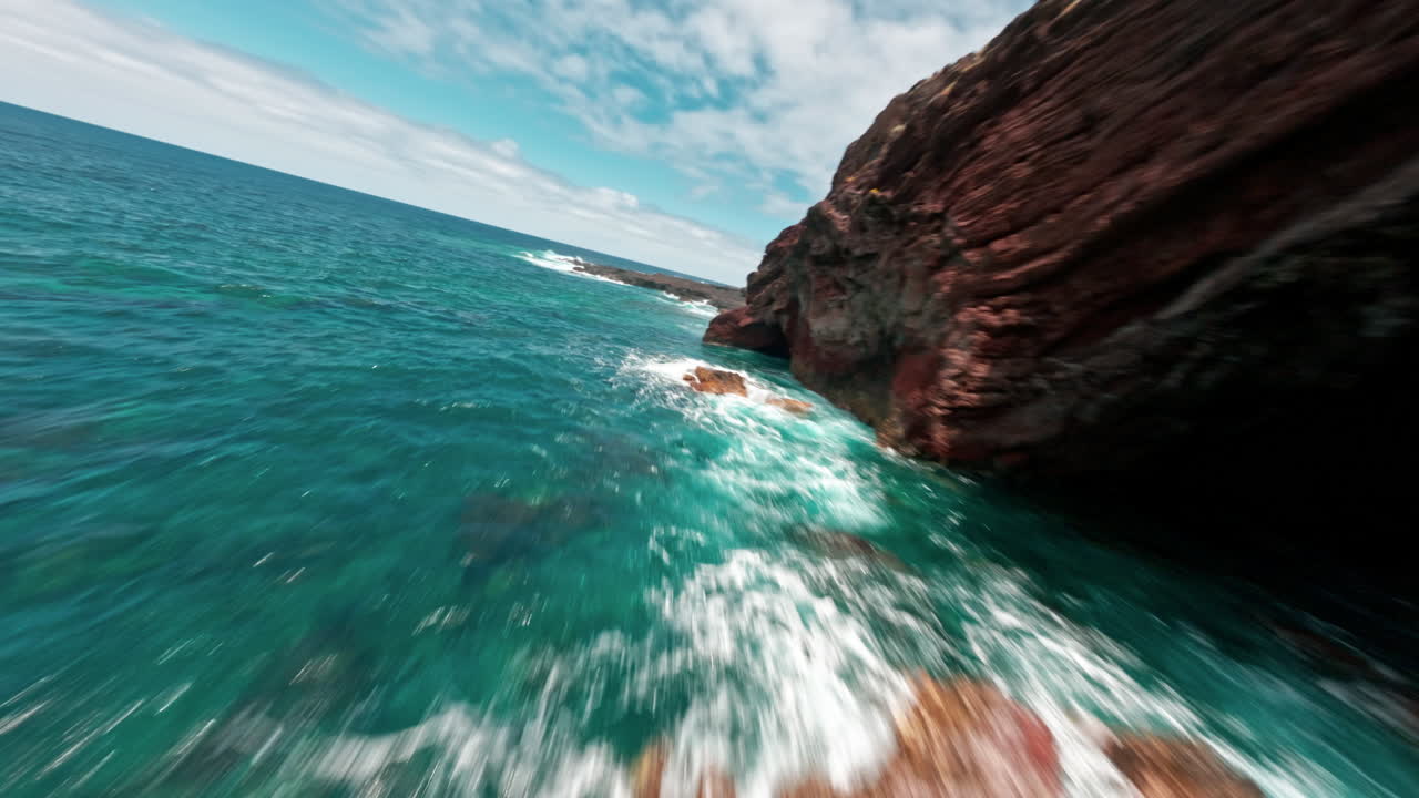 FPV drone over turquoise La Fajana coast, thrilling seaside flight