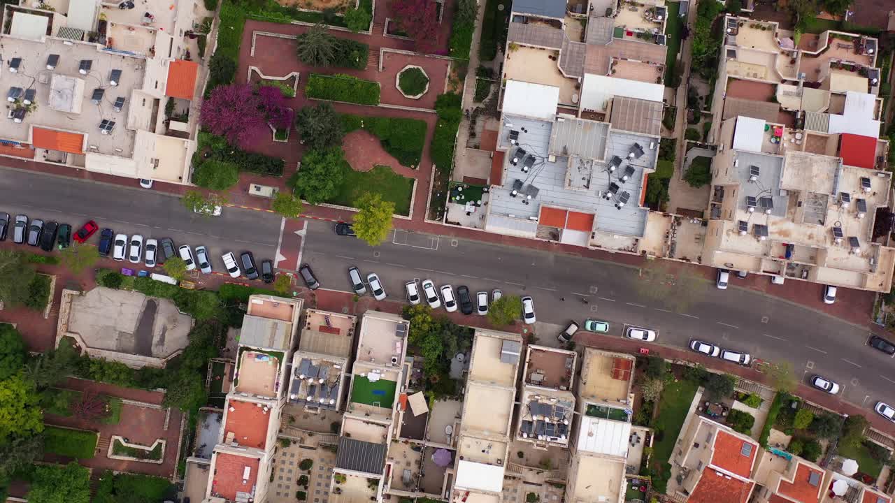Aerial Top-Down View of a Residential Neighborhood with Houses and Parked Cars