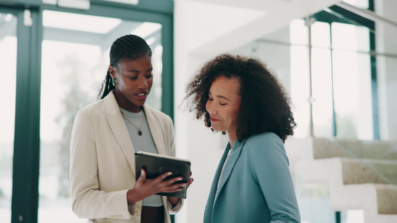 Two Businesswomen Have a Serious Discussion During a Meeting