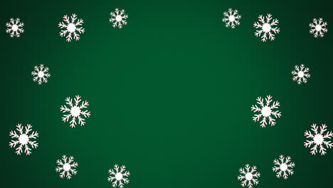 animación de copos de nieve navideños cayendo sobre un fondo verde
