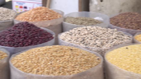 Pulses,-beans-and-legumes-on-display-at-the-traditional-spice-market-in-Manama,-Bahrain