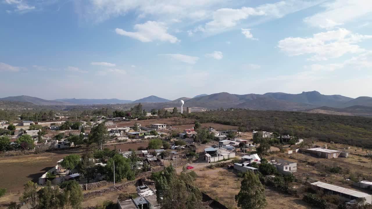 Water tank full of water in the middle of a town. Urban area. Drone shot.
