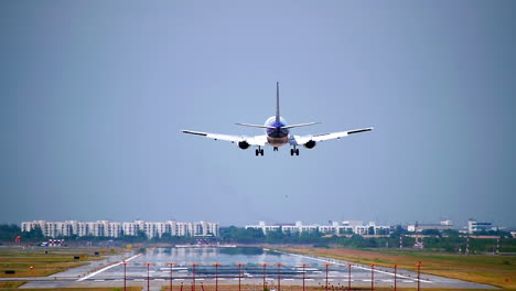 Commercial-aeroplane-or-airliner-on-a-final-approaching-landing-at-an-International-Airport-on-a-clear-morning-sky