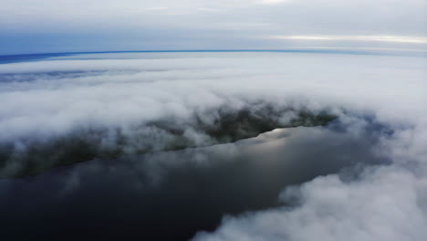 aerial view of a body of water partially covered by clouds