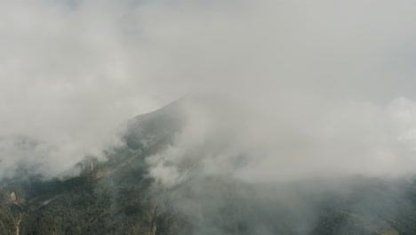 Mist-And-Clouds-At-Tungurahua-Volcano-In-Baños-De-Agua-Santa,-Ecuador---Aerial-Drone-Shot