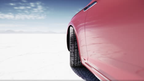 red car on a salt flat