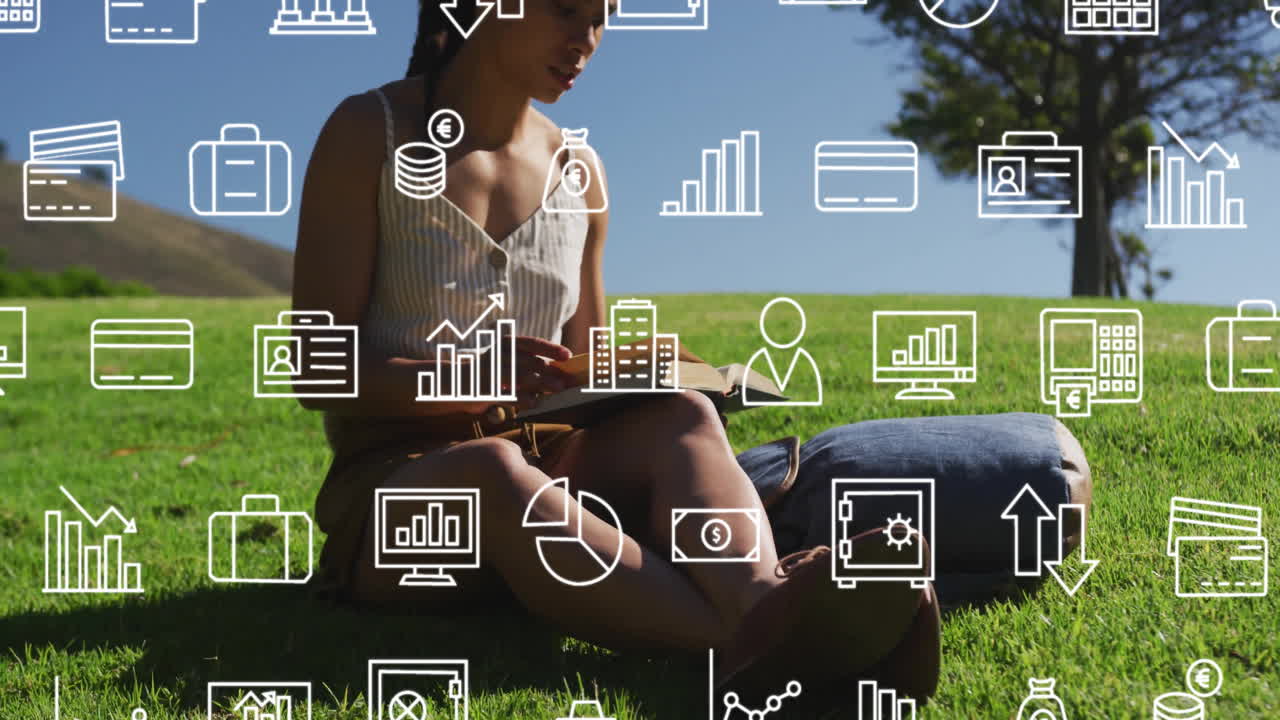 Sitting on grass, person interacting with animation of business icons overlay