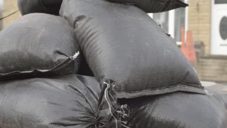 Pile-of-sandbags-on-pallets-panning-shot-close-up