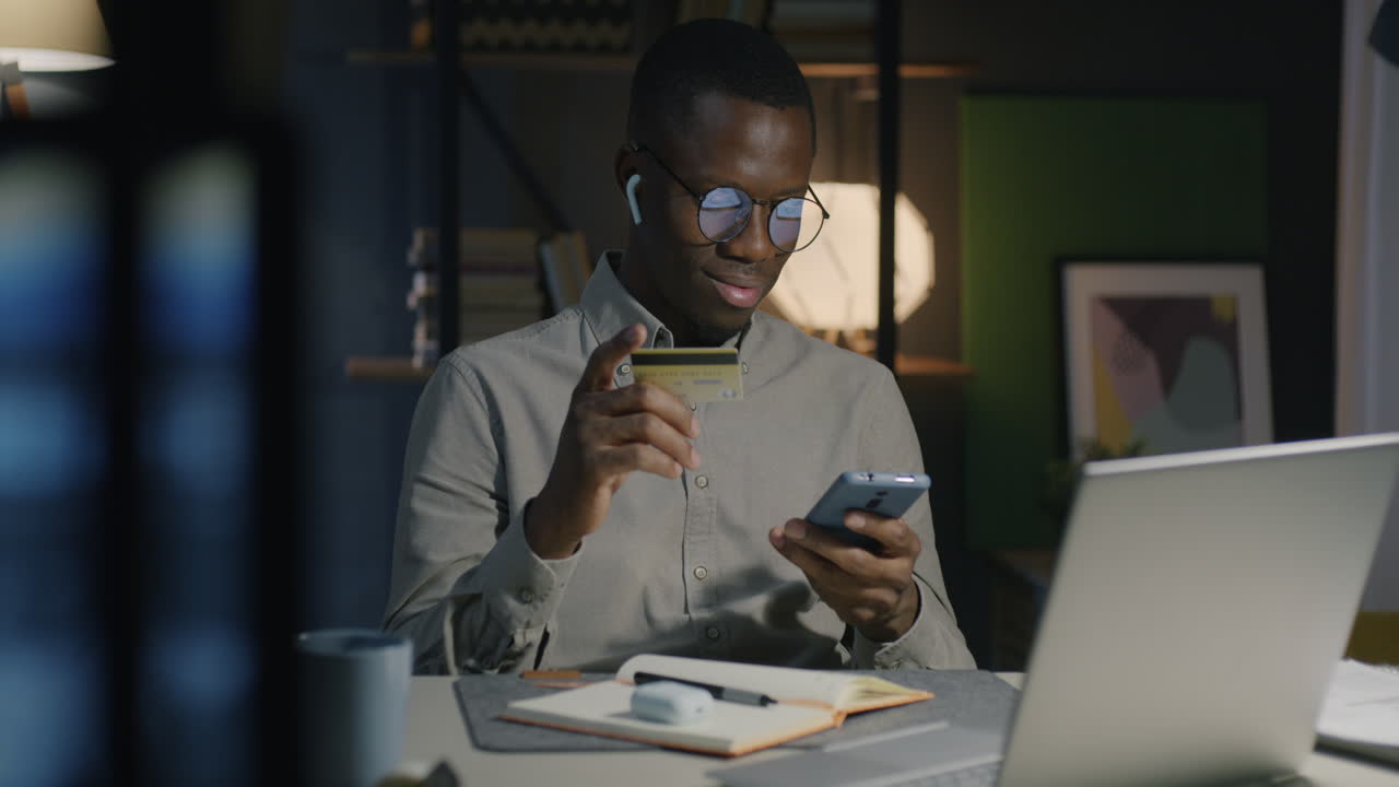 Man shopping online at night
