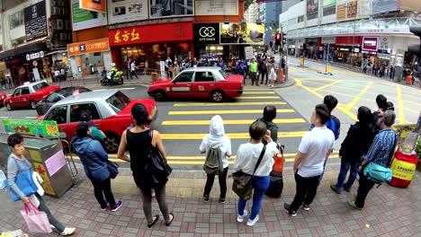 tourism crowds walking across the street in asia shopping street