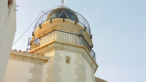 Close-Up-Of-Tall-White-Peniscola-Lighthouse-Near-Mediterranean-Sea-In-Castellon,-Spain