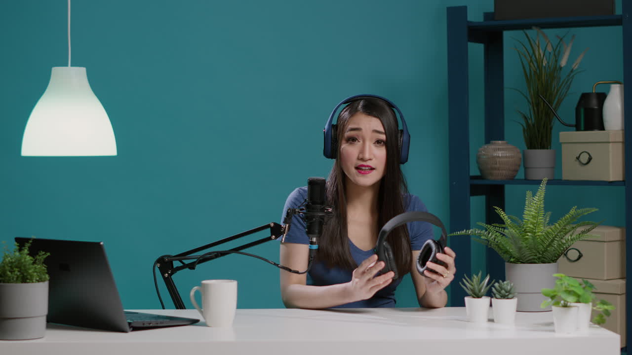 POV of asian woman doing recommendation of modern headphones