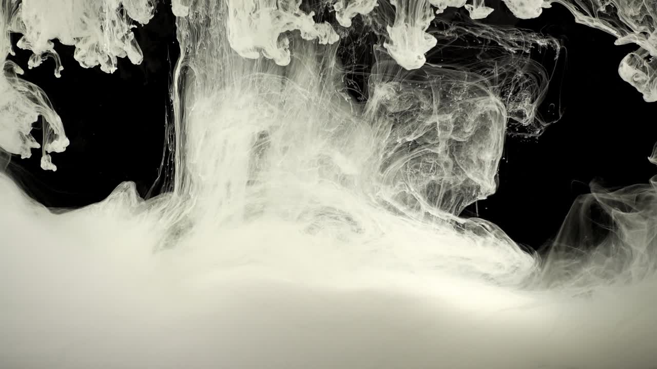 Paints. Abstract forms. Shooting on a black background
